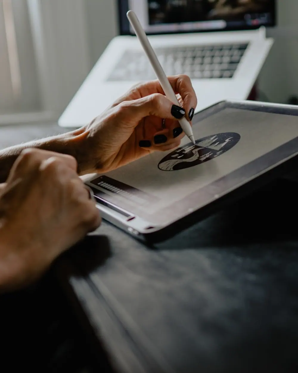 Designer sketching on a tablet in the studio